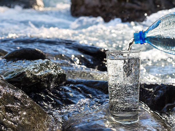 istock Water pouring into a glass from bottle 508751546