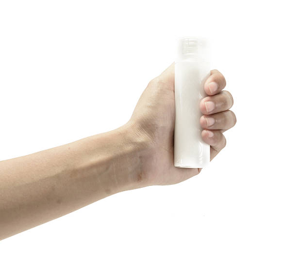 istock hand holding a skin cream 508754585