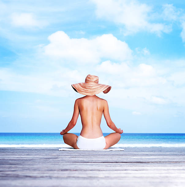 Back of views Attractive Asian young woman wearing white dress hug and enjoy with summer vacation on the beach feeling so happiness and cheerful,Travel in tropical beach in Thailand