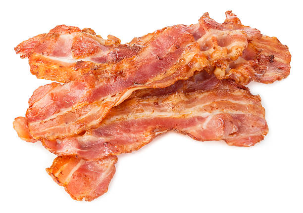 istock Cooked bacon rashers close-up isolated on a white background. 508755164