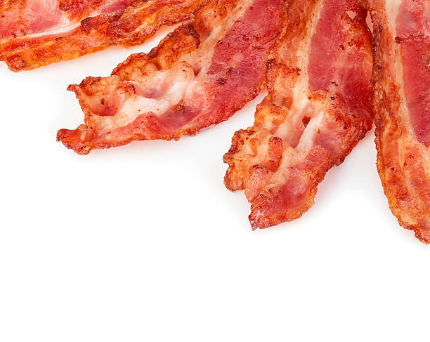 istock Cooked bacon rashers close-up isolated as a background. 508755368