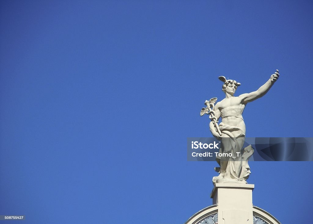 Hermes Ljubljana, Slovenia: September, 7th, 2012: A marble statue of Hermes on the top of the building against the blue sky. Mercury - Roman God Stock Photo