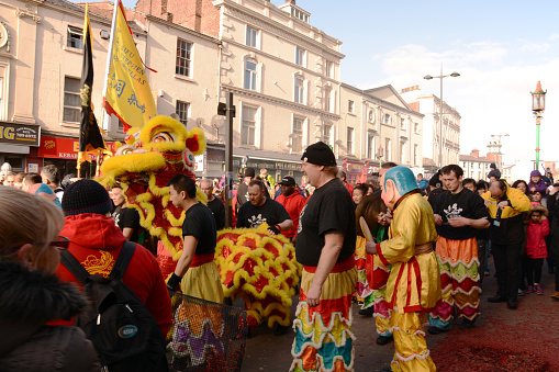 Liverpool, England - February 7, 2016: Liverpool Chinese New Year.  Symbol of the the year the Monkey. Crowd enjoying the parade