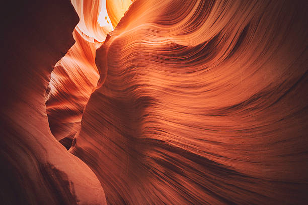 Lower Antelope Canyon, Arizona Wave shaped rock walls of the Lower Antelope Canyon outside Page, Arizona. eroded stock pictures, royalty-free photos & images