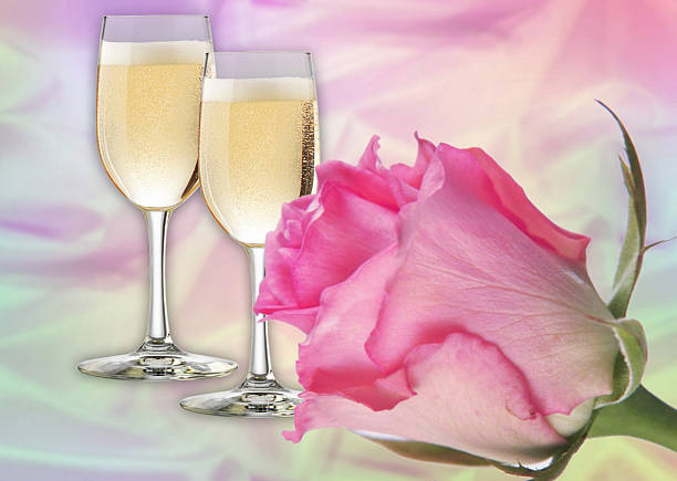 deux verres de champagne et à la rose - champagne wedding pink petal photos et images de collection