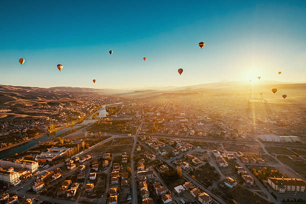 Ballons over Avanos town in Cappadocia. stock photo