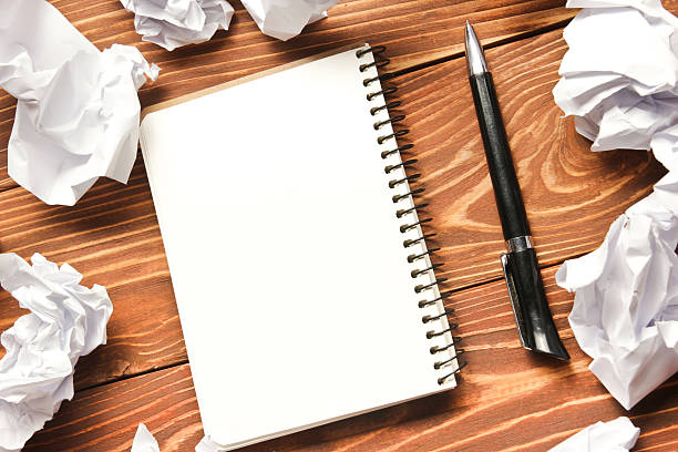 istock Office desk table with supplies and crumled paper. Top view 508762414