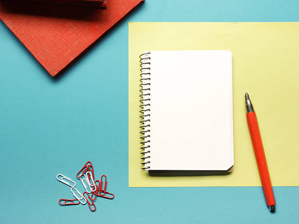istock Office desk table with supplies and crumled paper. Top view 508762632