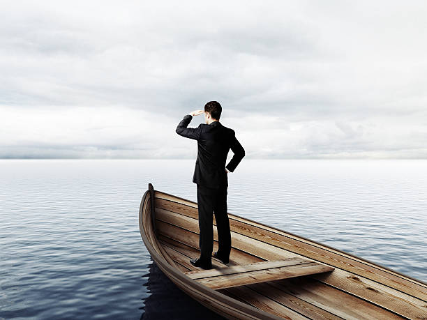 istock businessman standing on a boat 508764502