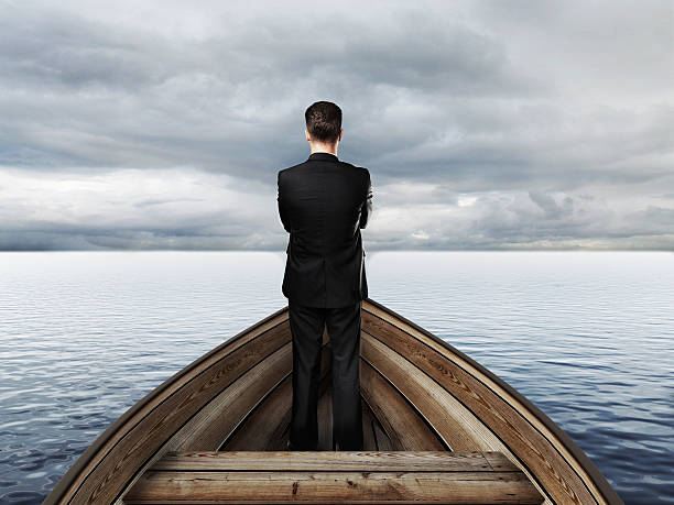 istock businessman standing on a boat 508764542