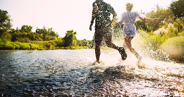 istock Happy couple running in shallow water. Summertime. 508784631