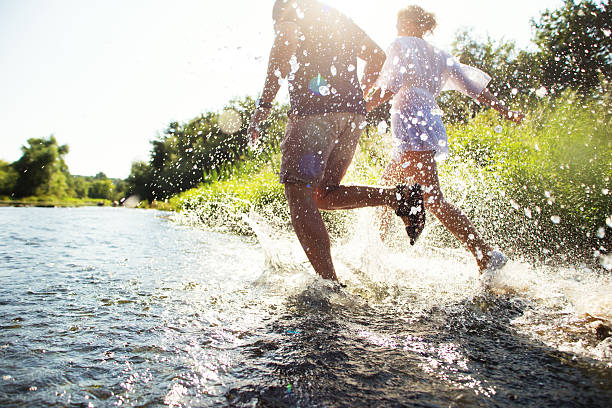 istock Happy couple running in shallow water. Summertime. 508784633