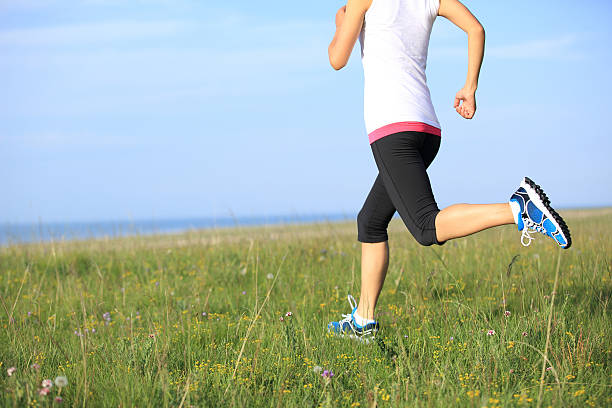 istock Runner athlete running on sunrise/sunset grass field 508785081