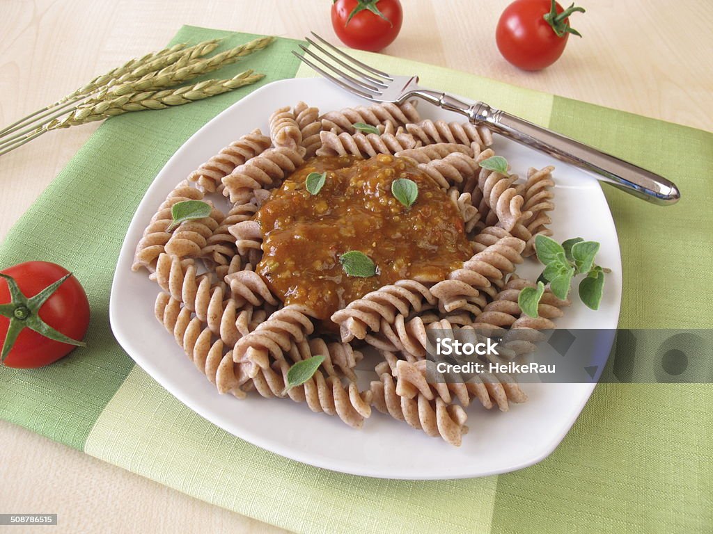 Wholemeal pasta with green core bolognese Wholemeal pasta with green core bolognese - Vollkorn-Nudeln mit Grünkern Bolognese Pasta Stock Photo