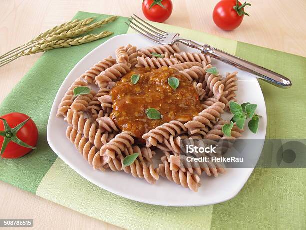 Wholemeal Pasta With Green Core Bolognese Stock Photo - Download Image Now - Pasta, Spelt, Noodles