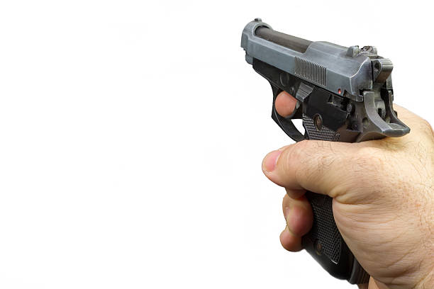 istock semiautomatic pistol in a hand with white background 508786979
