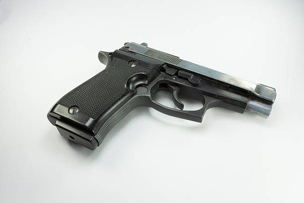 istock pistol semiautomatic with white background 508787193