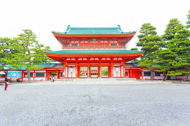 Kyoto, Japan - June 19, 2015: Centered large red main Tower Gate Ro-Mon at the chinowa-kuguri decorated front entrance of Heian-Jingu Shinto Shrine in Kyoto, Japan. Horizontal