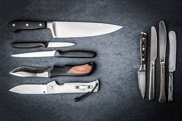 istock Collection knives on a gray stone 508788178