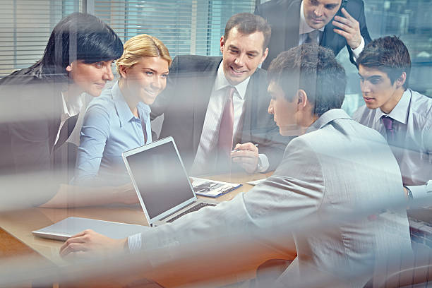istock business people at meeting 508788533