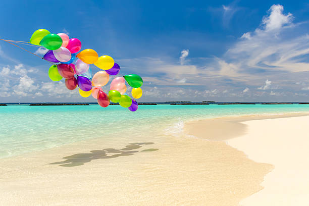 Colorful balloons flying in the wind stock photo