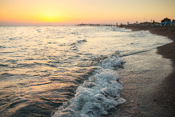 istock Shiny sea waves on the beach sand in sunset light 508789219