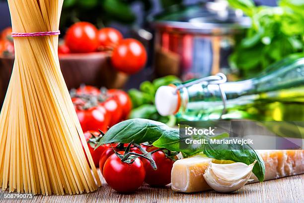 Basil Leaves Garlic Penespghetti And Cherry Tomatoes Stock Photo - Download Image Now