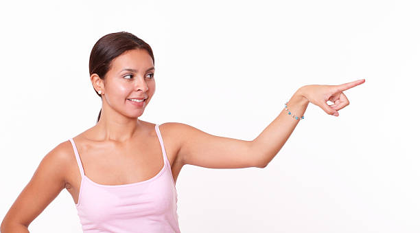 istock Smart hispanic girl pointing to her left 508790205