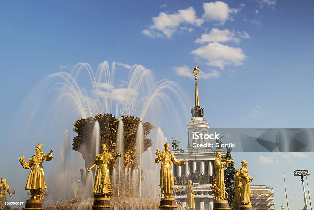 Fountain friendship of people in VDNKH, Moscow, Russia Fountain Friendship of Nations and Central pavilion at All-russia Exhibition Center in Moscow Architecture Stock Photo