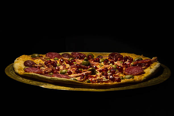 istock homemade pizza on a black background on a tray 508791042