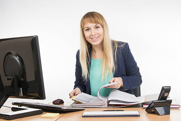 istock Secretary leafing through papers big folder and looked into frame 508791808
