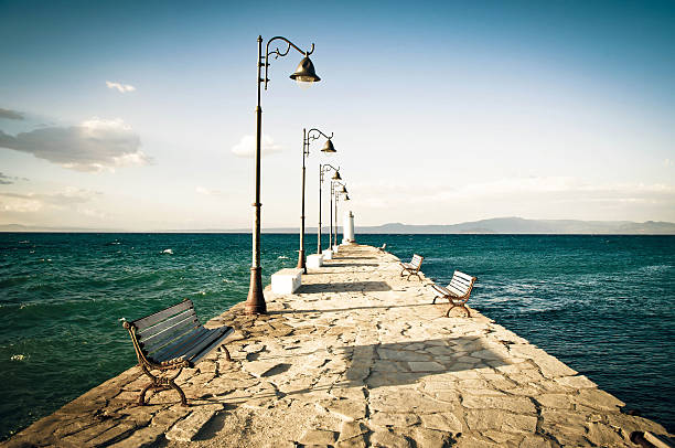 Stone dock on the beach in Pefkochori, Greece 
