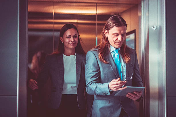 istock Business couple in the elevator 508793696