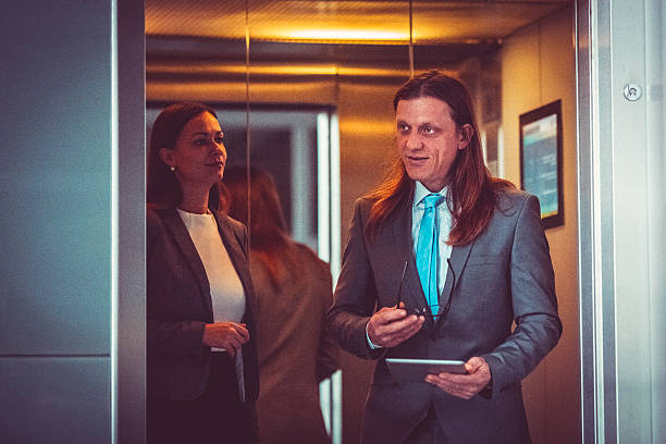 istock Business couple in the elevator 508793766