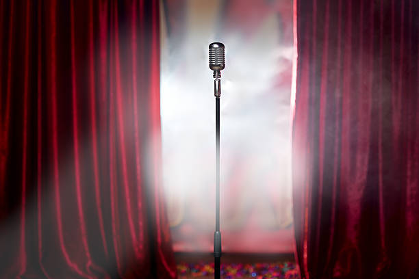 retro microphone and red curtain the microphone in front of red curtain on an empty stage after the concert, smoke dynamic microphone stock pictures, royalty-free photos & images