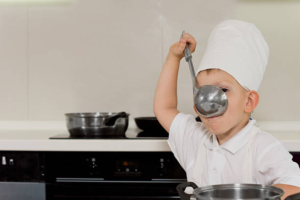 istock Young chef tasting soup from ladle 508796242