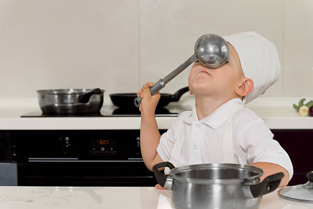 istock Silly boy with ladle in his face 508796250