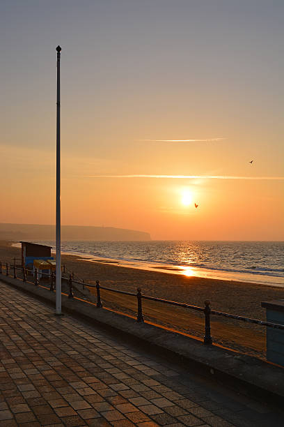 istock Sunrise and Flag Pole at the Beach 508810556