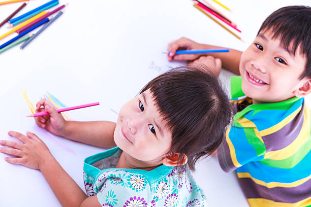 istock Children looking at the camera and smiling. 508811840