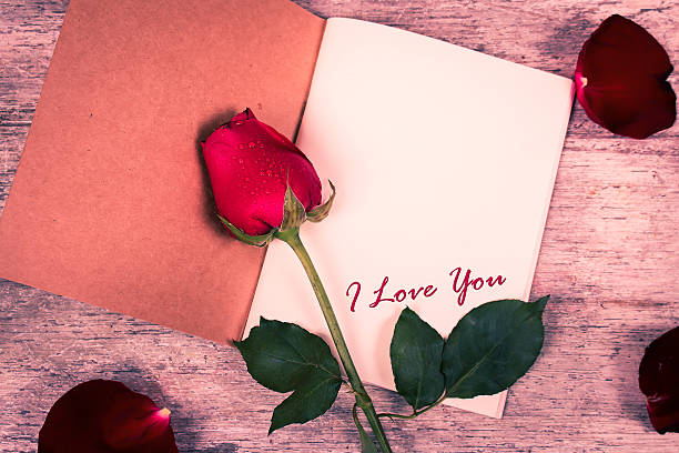 istock I love you text on notebook and red rose flower 508811948