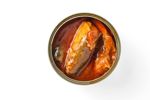 open can of sardines in tomato sauce isolated on white