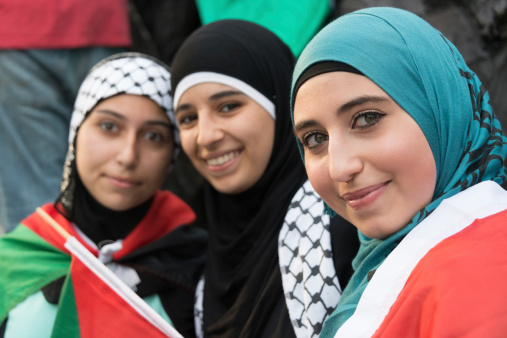 Philadelphia, PA, USA- July 27, 2014: Muslim young women posing at an anti Gaza Israeli bombardment demonstration at Philadelphia downtown