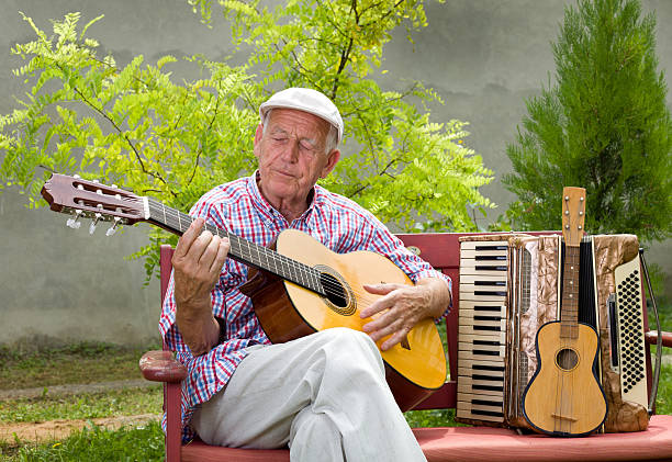 istock Senior man with guitar 508813777