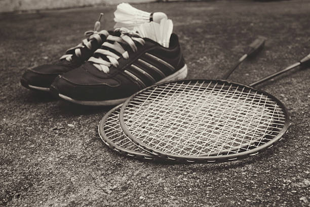 istock Sport shoes with shuttlecocks and badminton racket. 508814862