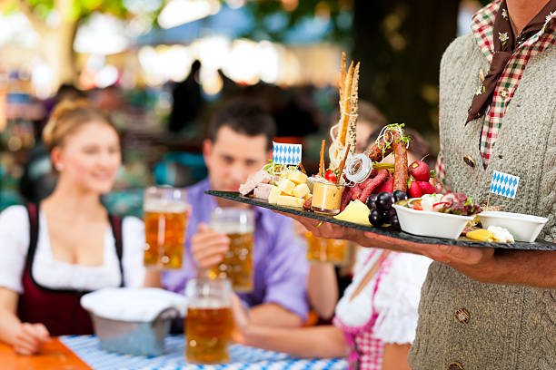 In Beer garden - snacks and drinks In Beer garden in Bavaria, Germany - beer and snacks are served, focus on meal oktoberfest food stock pictures, royalty-free photos & images
