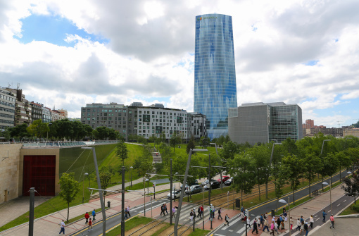 Bilbao, Spain - July 10, 2014: Unidentified people walking in front of the Iberdrola Tower in the center of Bilbao, Basque country, Spain.