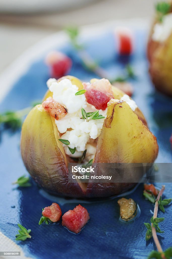 Grilled Figs Grilled figs stuffed with goat cheese, pancetta, and thyme. Appetizer Stock Photo