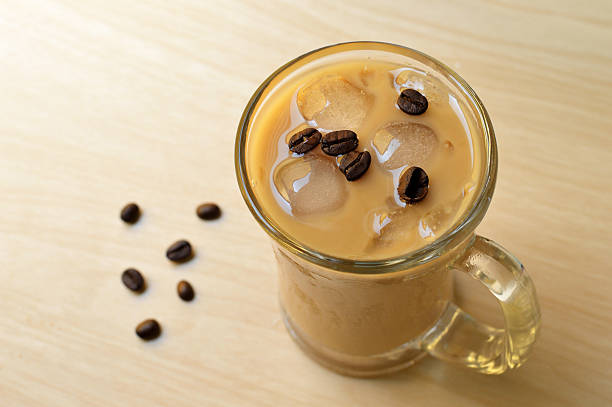 istock Glass Of Cold Coffee On Wood table 508818586