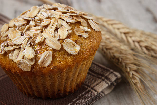 istock Fresh muffin with oatmeal and ears of rye grain 508819850