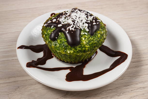 istock Fresh muffin with spinach, desiccated coconut and chocolate glaze 508820074